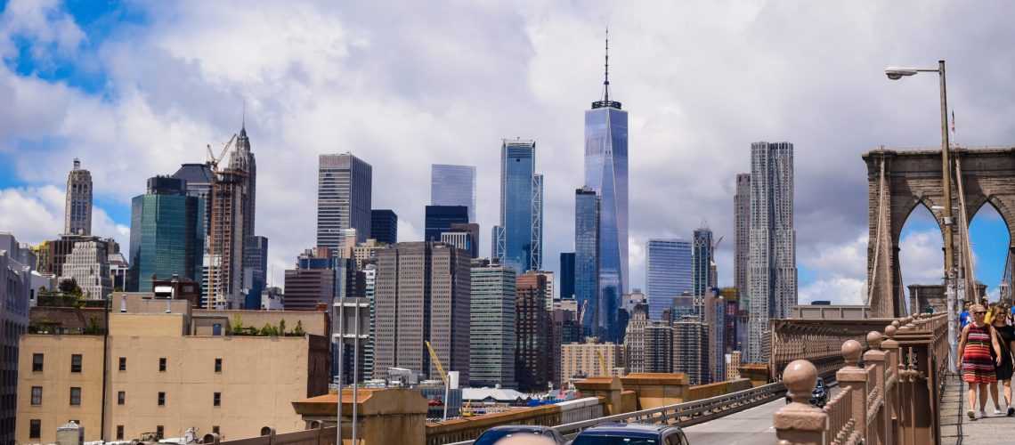 city buildings under white clouds during daytime